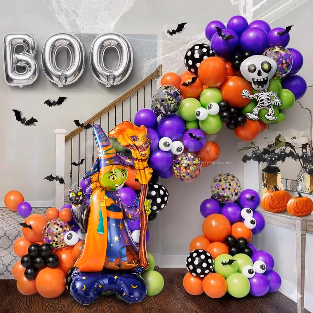 Make Halloween photos fun with a bright balloon and foil backdrop.