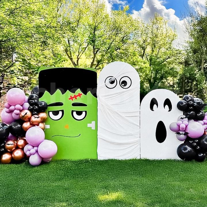 Create spooky photo moments with ghostly figures and balloons.