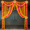 Floral drapes and lights highlight the golden and festive look of the entrance.