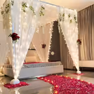 White Wisteria hanging on the white fabric creates a heavenly, romantic room decor