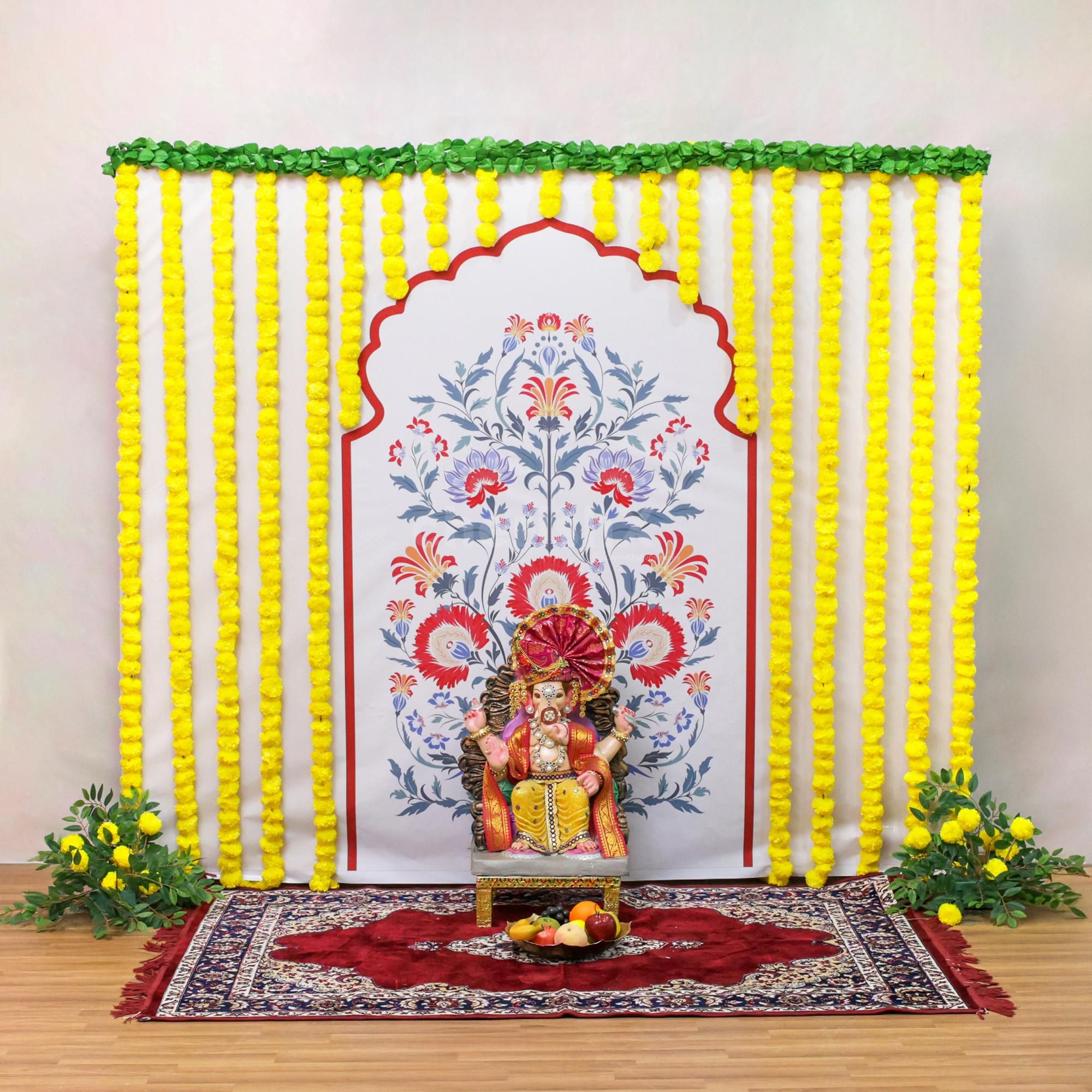 Yellow garlands bring traditional auspiciousness and cheerful energy to the puja spot