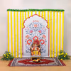 Yellow garlands bring traditional auspiciousness and cheerful energy to the puja spot