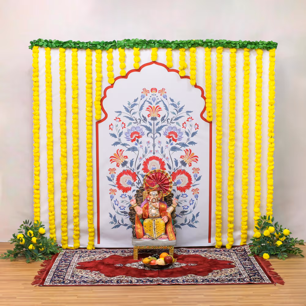 Yellow garlands bring traditional auspiciousness and cheerful energy to the puja spot