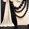 Black latex balloons add a dramatic effect and form an impressive background