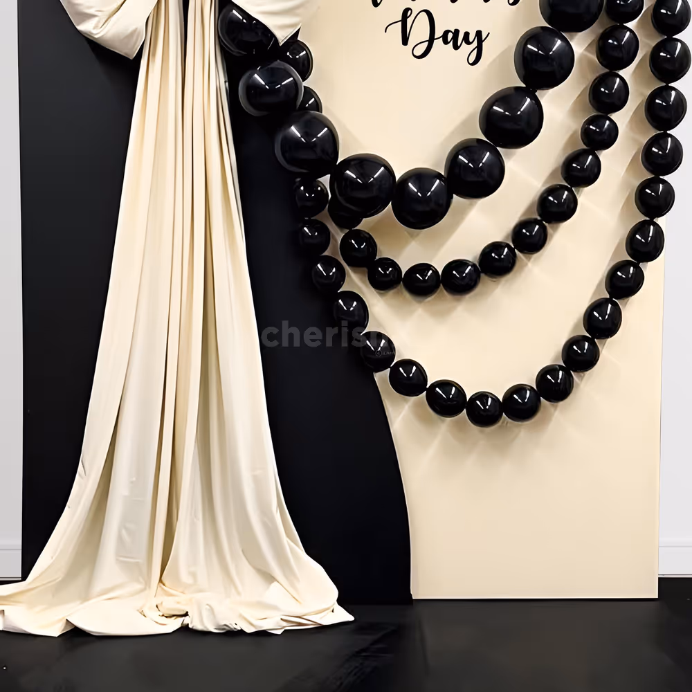 Black latex balloons add a dramatic effect and form an impressive background