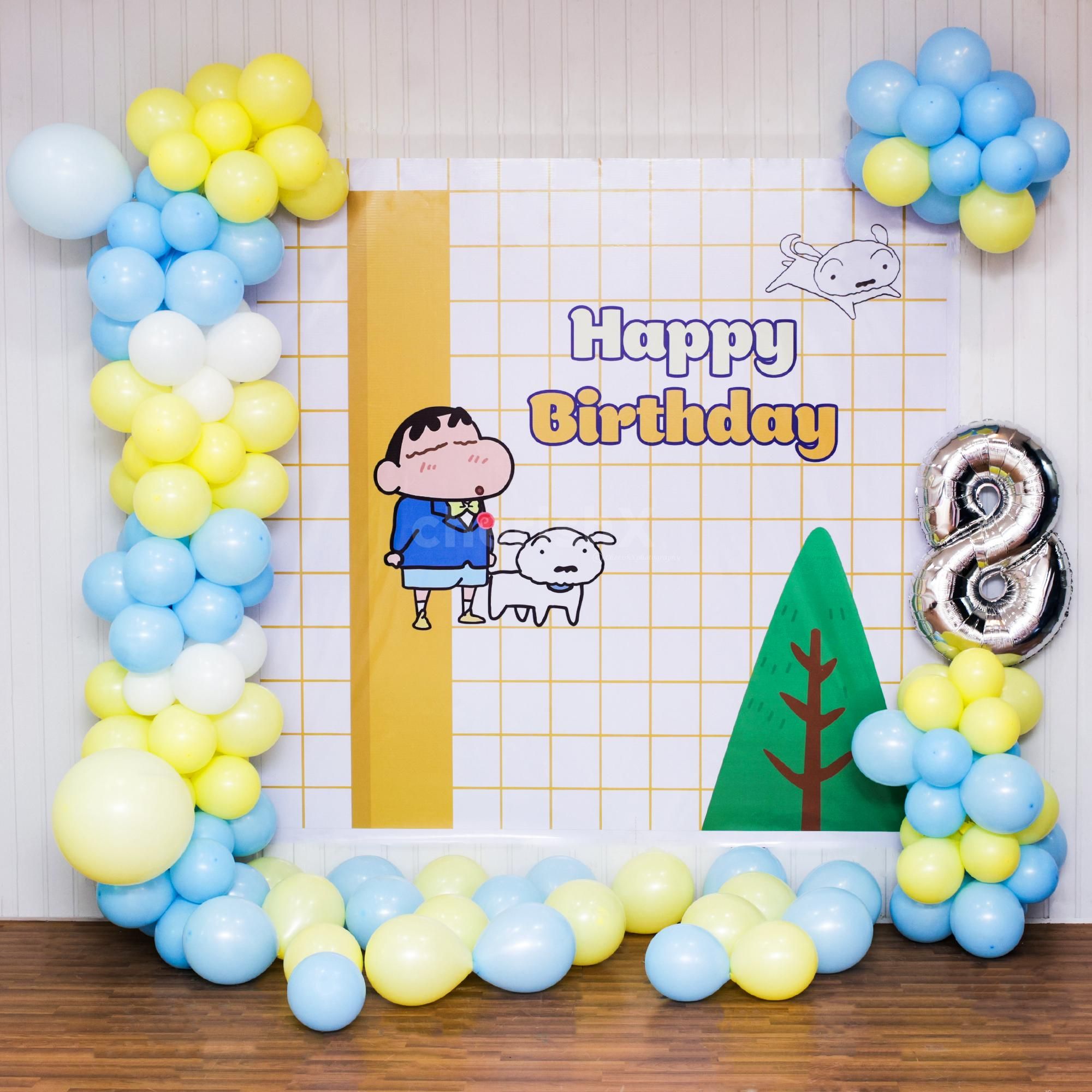 A happy pastel Shinchan backdrop invites birthday merriment.