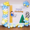 A happy pastel Shinchan backdrop invites birthday merriment.