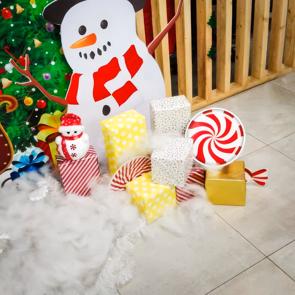 Cotton fluff gives a snow-like feel, adding soft texture around the flex banner on the stand