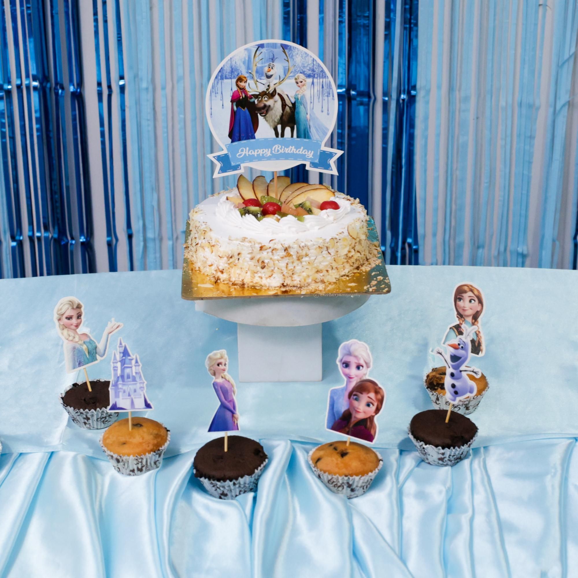 Shimmering foil stars and bunting enhance the frozen birthday bash decor
