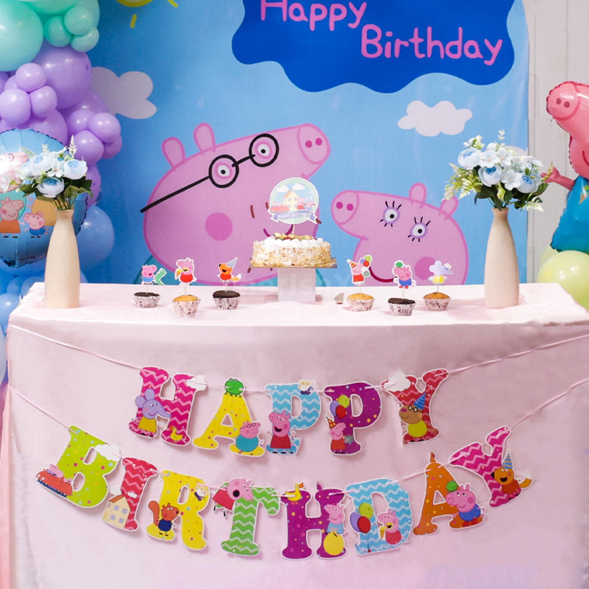 Ceiling balloon bunches lift the mood at peppa pig birthday bash