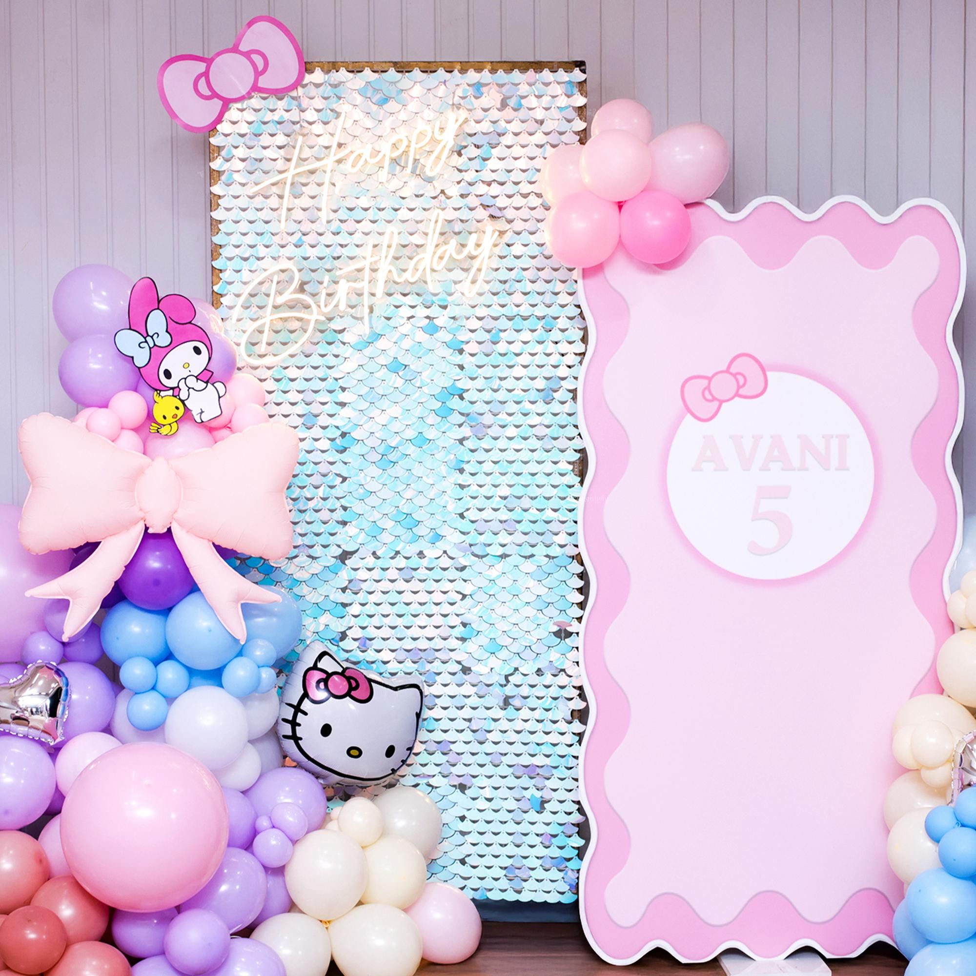 Playful pink bow balloon creates a signature party vibe.