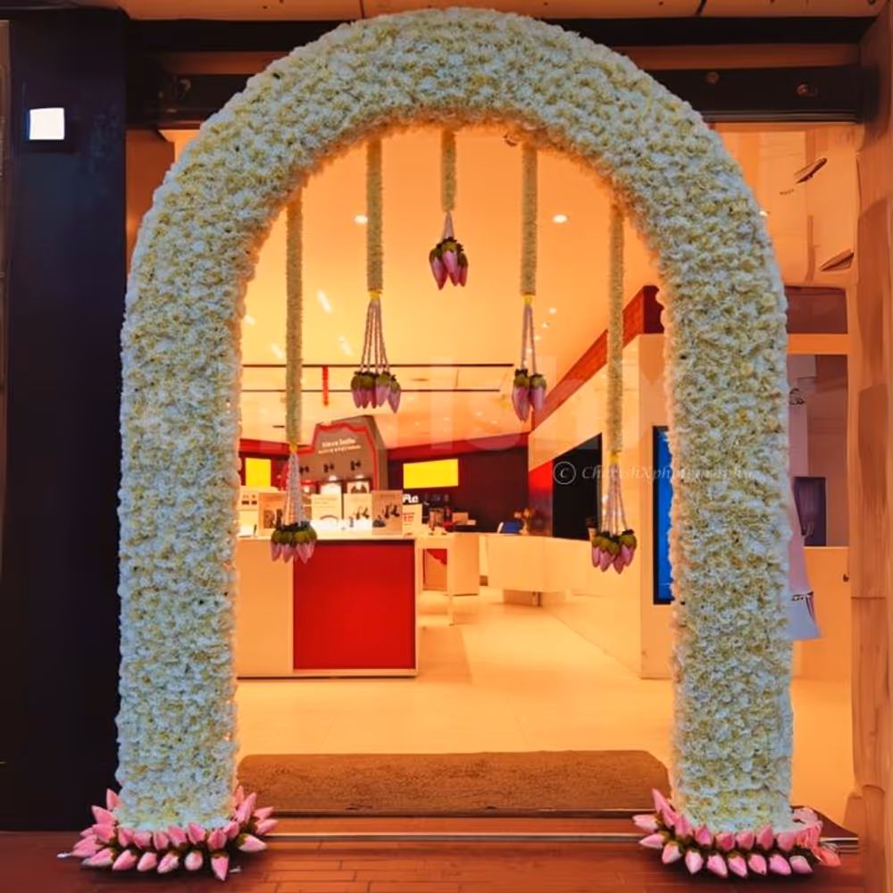 White lotus flowers shape a calm and elegant entrance at any venue