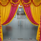 Floral strands enhance the cheerful entry arrangement beautifully.