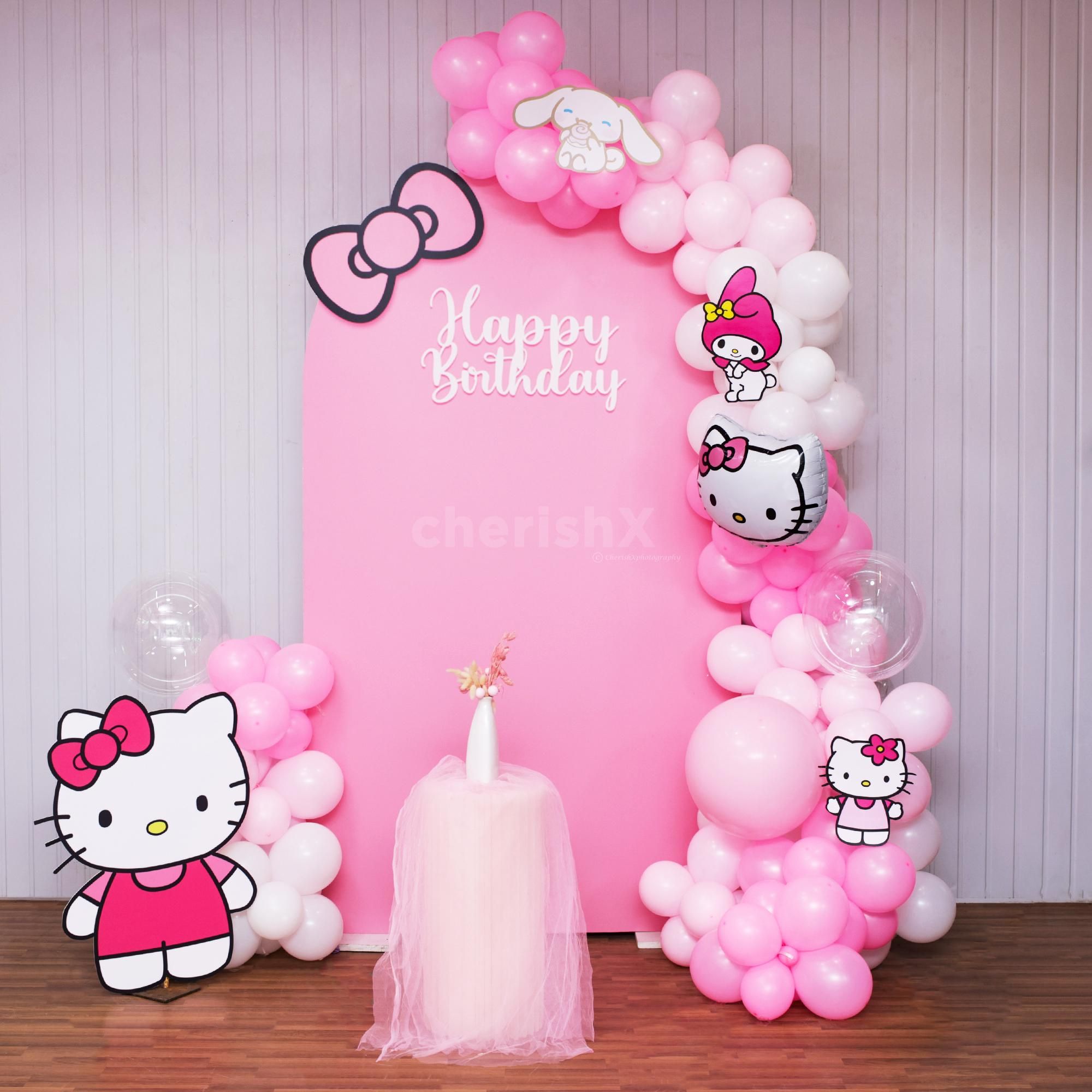 Pastel pink Hello Kitty backdrop for a picture-perfect party.