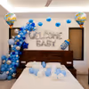 A striking blue and silver balloon arch beautifully frames the welcome message.