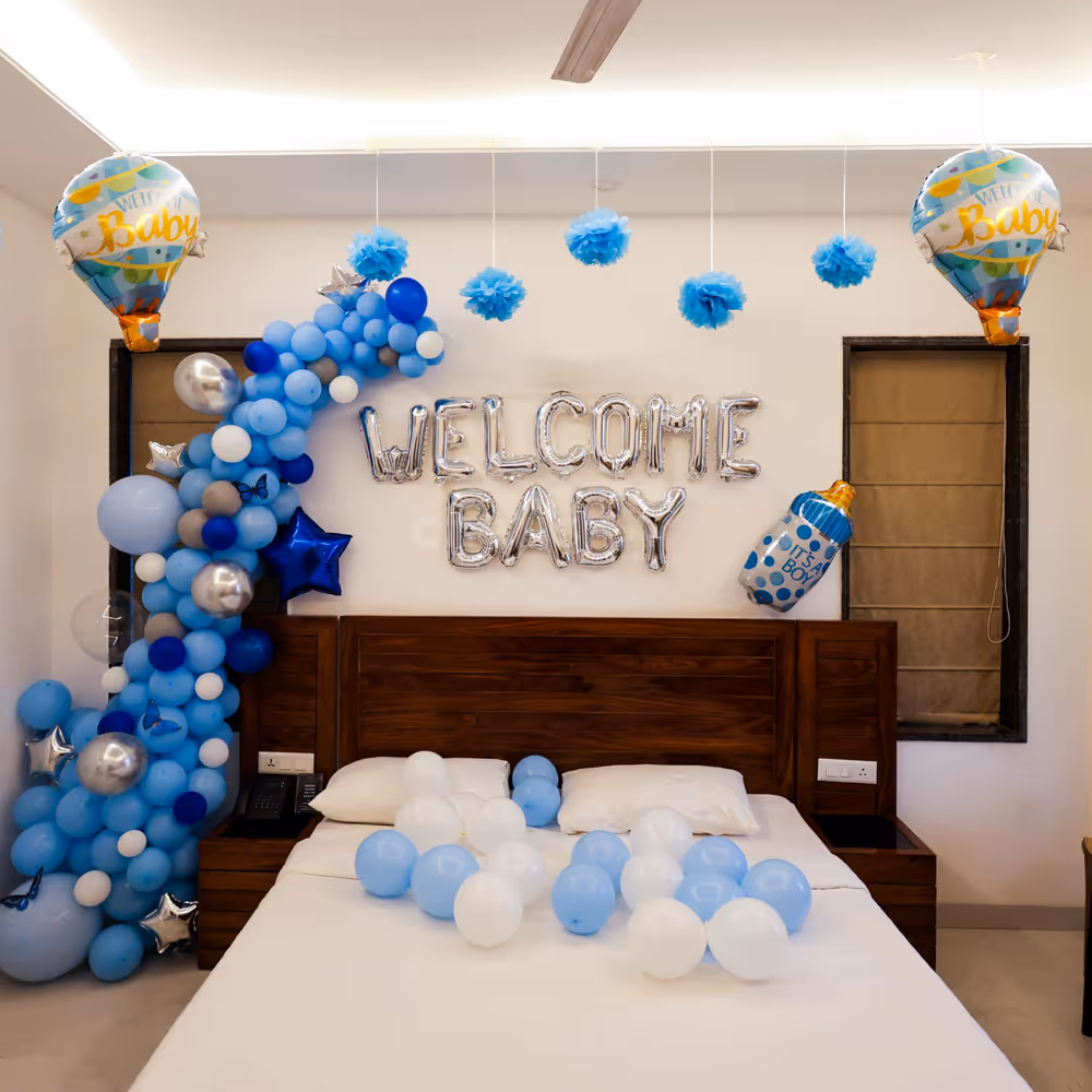 A striking blue and silver balloon arch beautifully frames the welcome message.