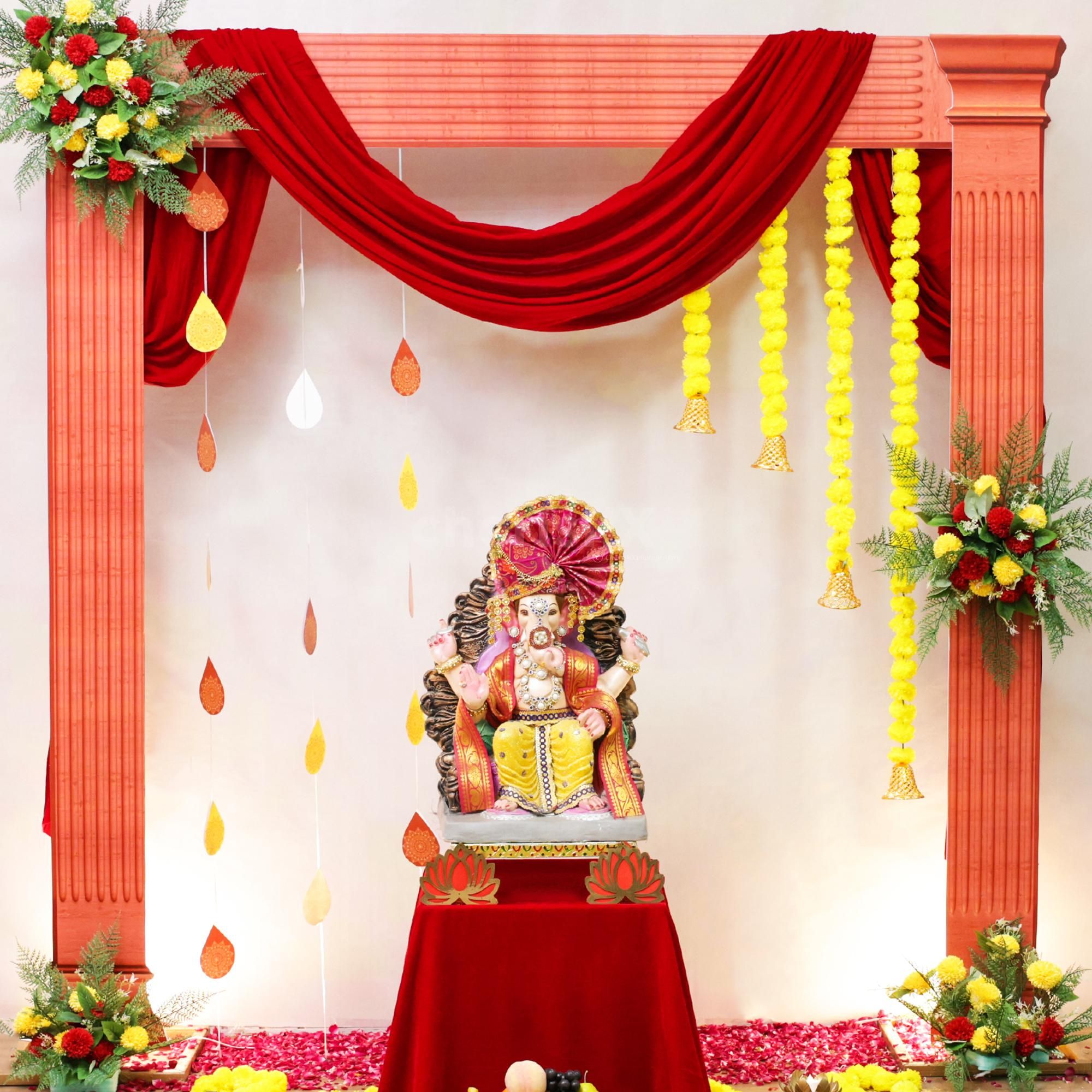 Lotus MDF garlands and candle stands ensure the ambiance is sacred