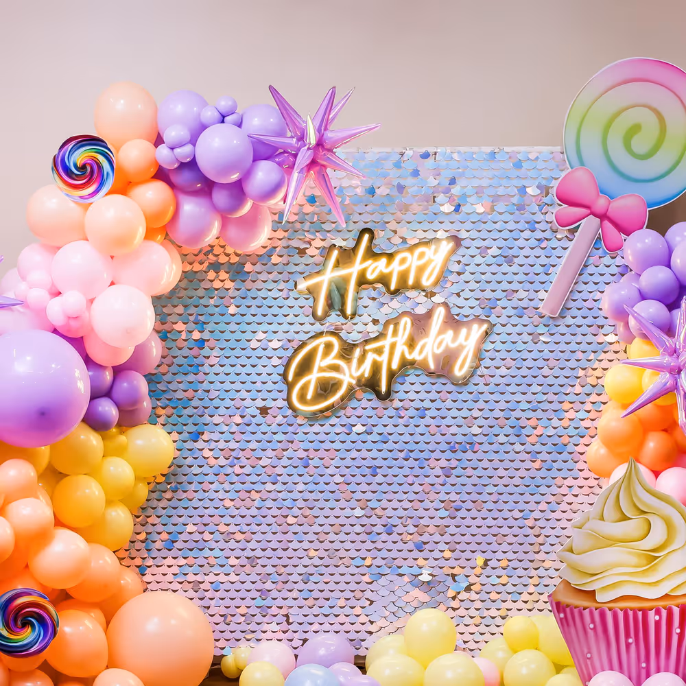 Three holographic 4D star foil balloons twirl and shine, adding texture to the decoration