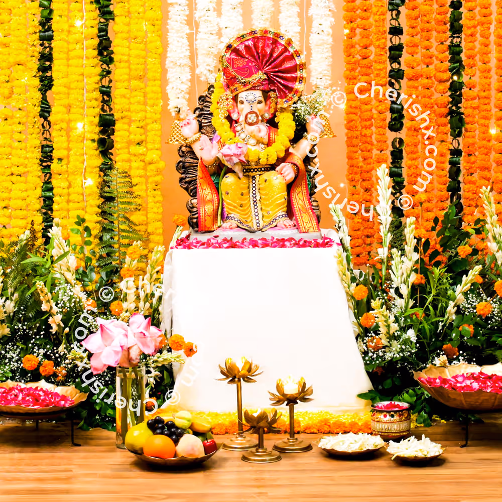 Ganesh Chaturthi Orange and yellow marigold flowers ensure festive serenity remains intact
