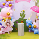 Balloons arch weaves the colours together in a playful backdrop and frames the display