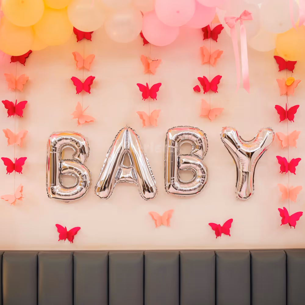 Free-flying and anchored balloons add a whimsical touch to the bed and floor.