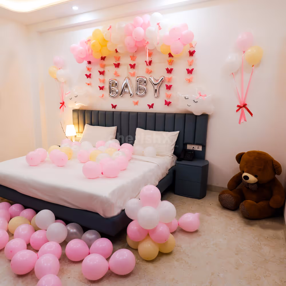 Foil letters are elegant and spell "BABY" to celebrate the arrival of the little one.