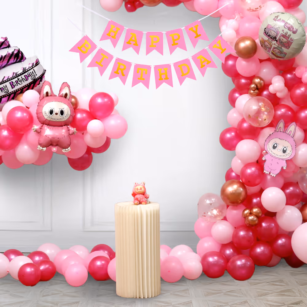 Labubu cutouts and foil balloons add the drama and twist of a modern element