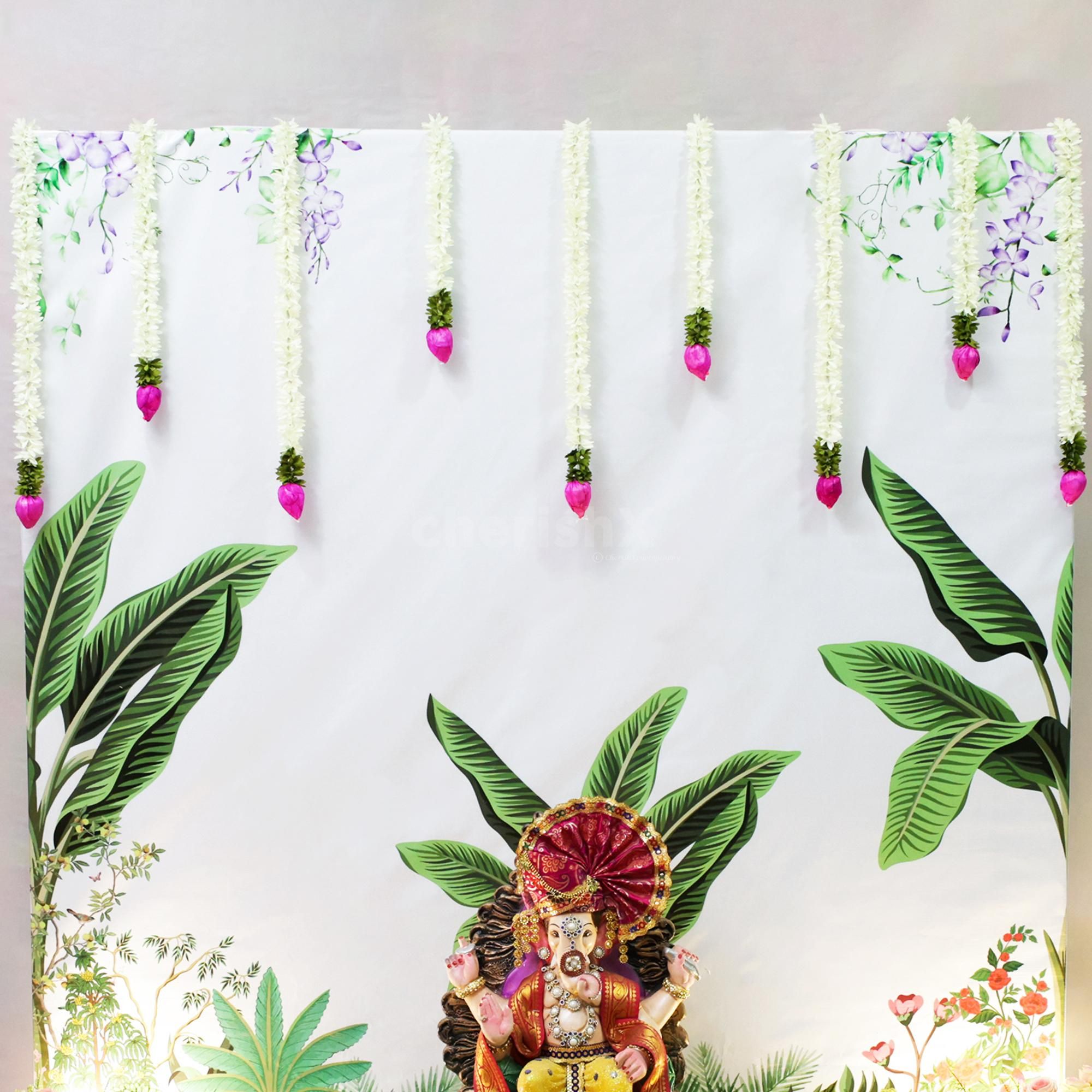 Lotus and Jasmine flowers hangings make the setup pop up the sacred feelings