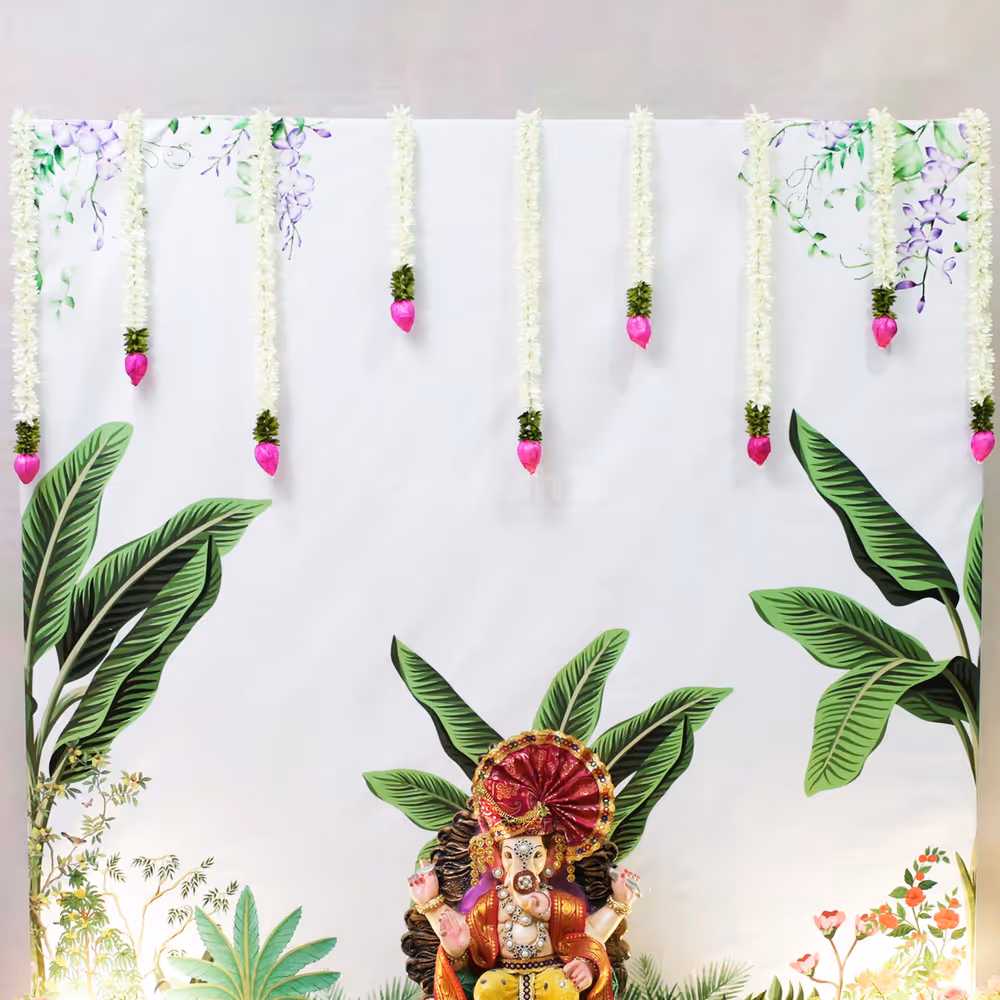 Lotus and Jasmine flowers hangings make the setup pop up the sacred feelings