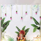 Lotus and Jasmine flowers hangings make the setup pop up the sacred feelings