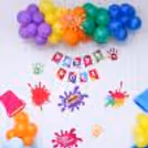 A cheerful balloon arch that captures the ideal Holi celebration atmosphere!