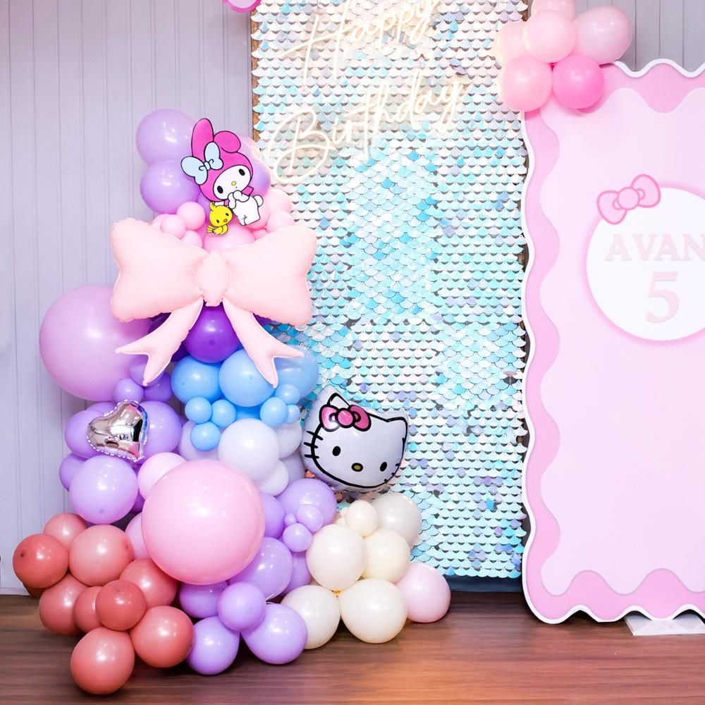 Glittery sequin background with a pastel balloon frame.