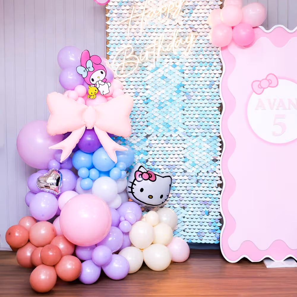 Glittery sequin background with a pastel balloon frame.