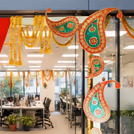 The entrance backdrop of the celebration is embellished with artistic cutouts.