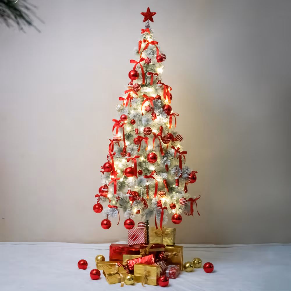 Red and golden gift boxes under tree perfectly compliments the celebratory mood