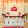 Fairy lights and red velvet tassels add elegant festivity to the office's Diwali spirit.