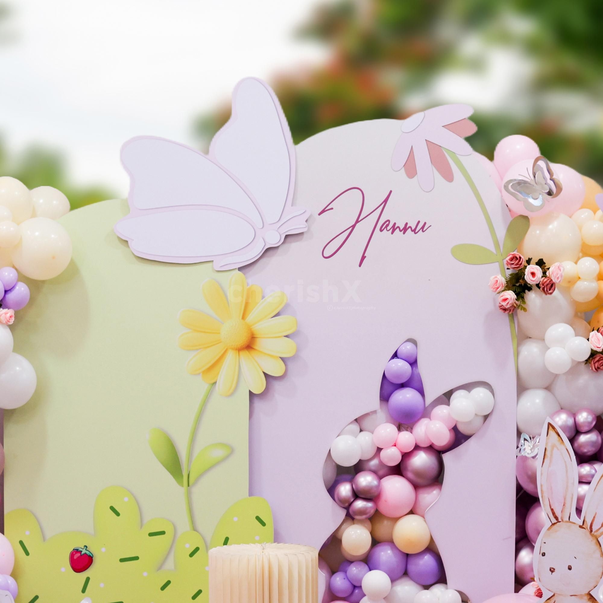 Bunches of light pink artificial roses add a soft touch to the arrangement with a garden-inspired feel