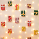 Colourful gift box arrangement on the wall highlights joy and gift expectation during celebration