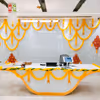 Yellow garlands are visually pleasing and boost positivity and energy in the ambiance.