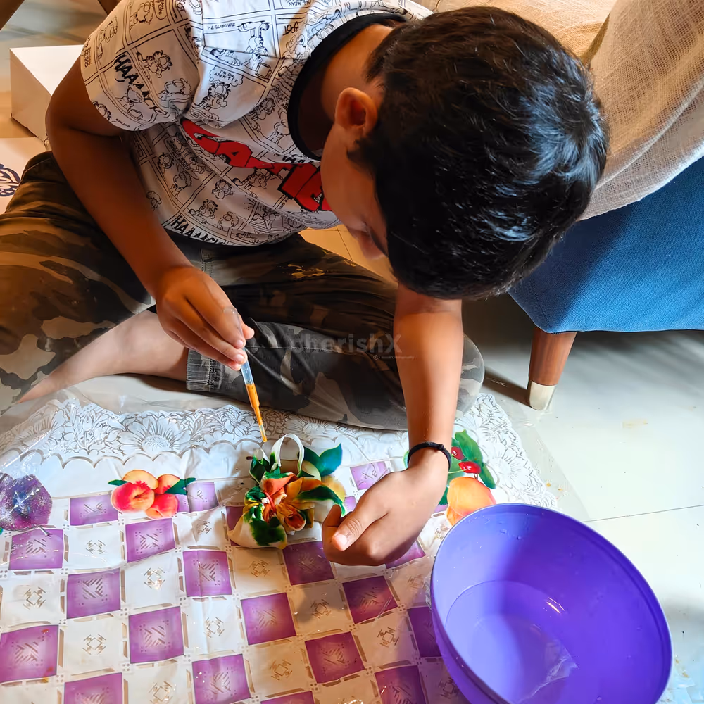 Kids twisting fabric into colourful dream designs