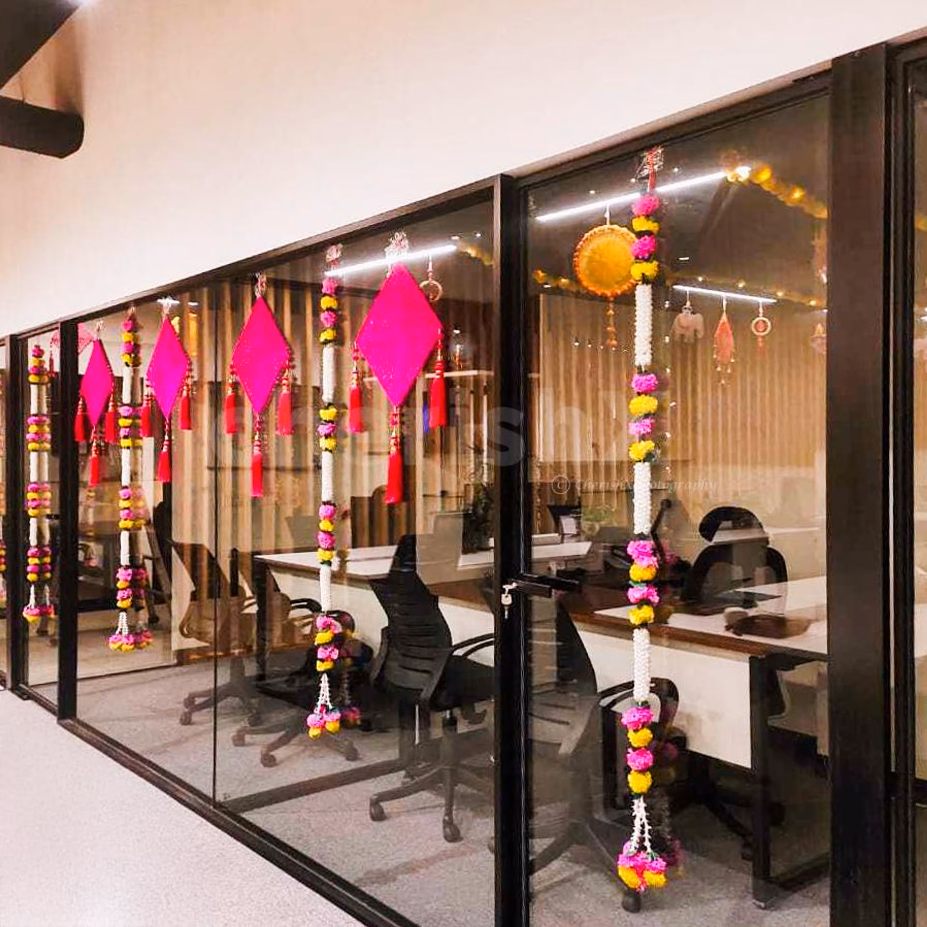 Pink crochet kites hangings add eye-catching colour to the glass walls by sticking easily