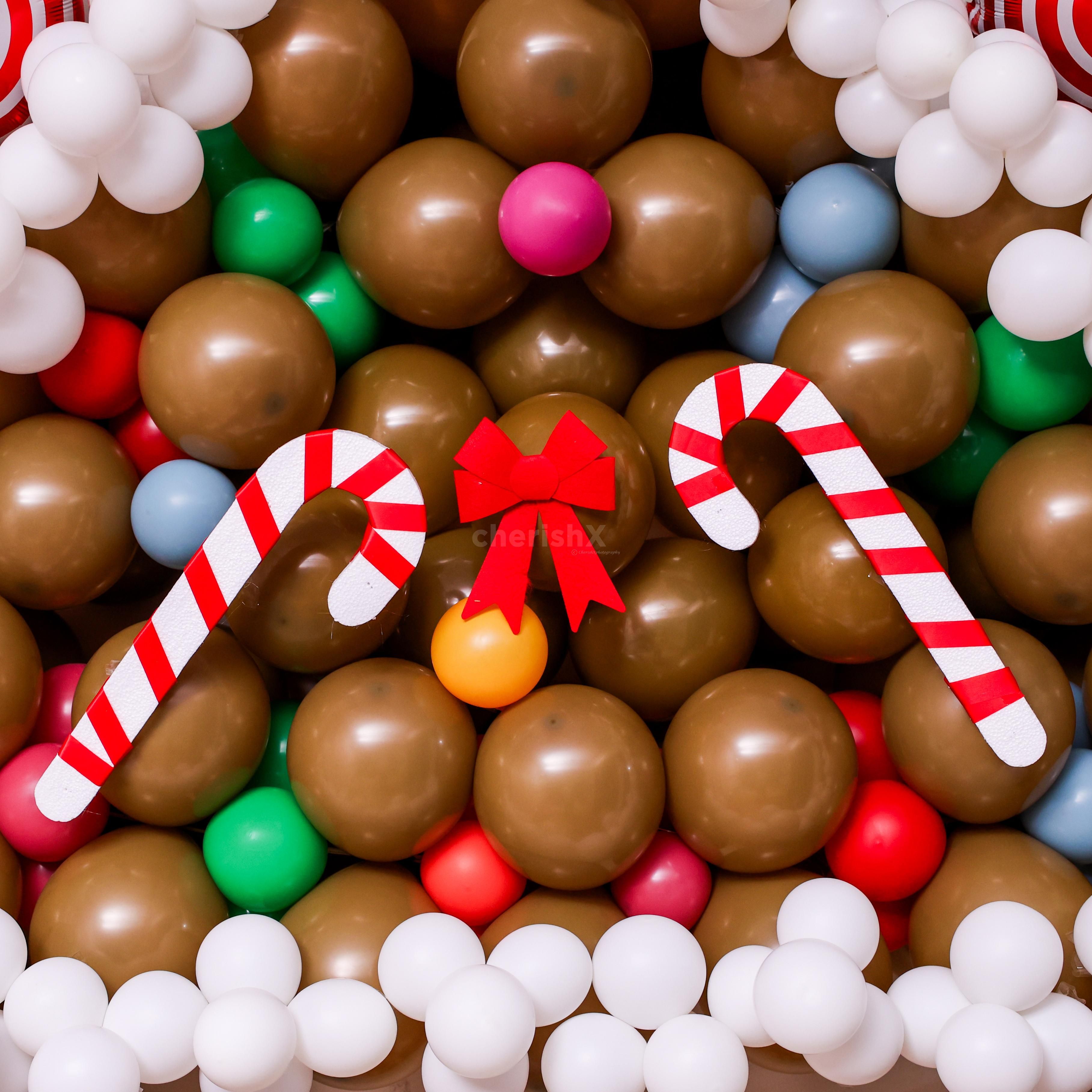 Balloon arch made with vintage Choco brown, latex white, and multicolored balloons