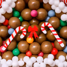 Balloon arch made with vintage Choco brown, latex white, and multicolored balloons