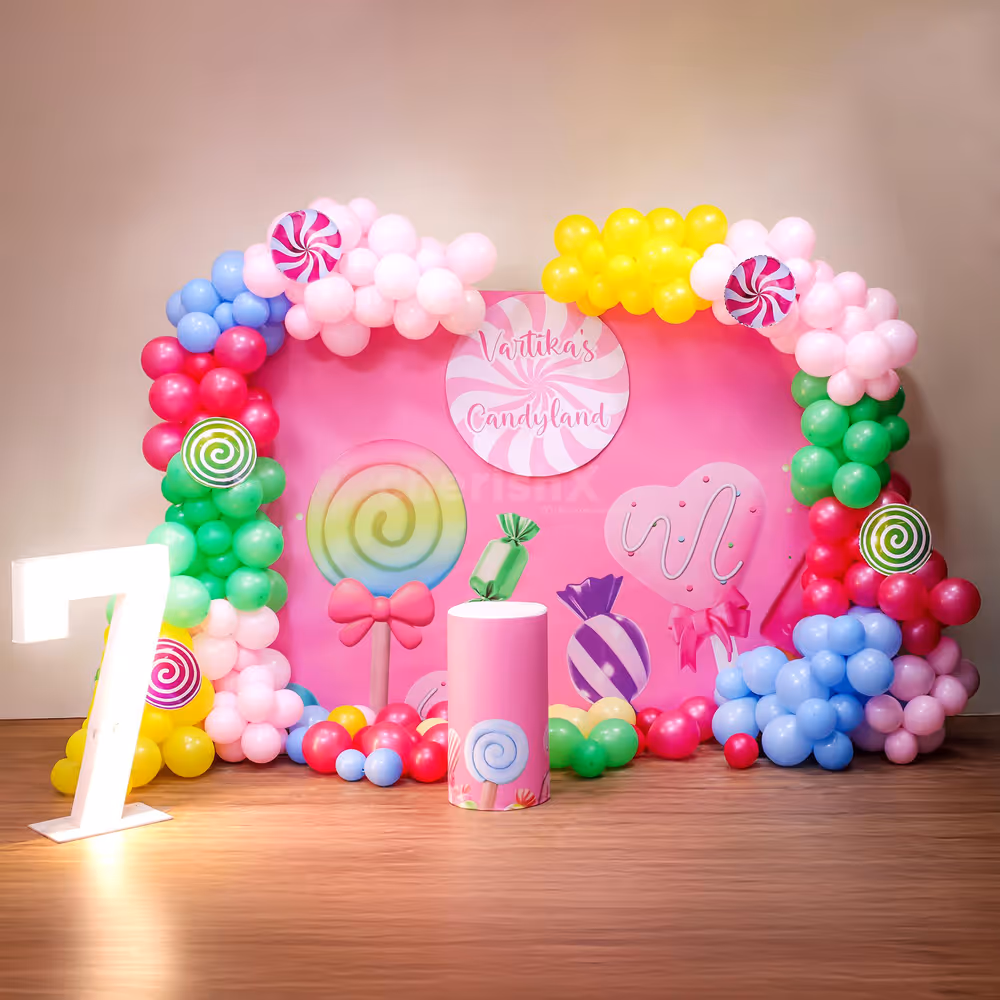 The balloon arch creates a mesmerising backdrop on the customised flex on the stand.