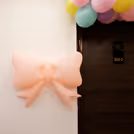 Soft pink, purple, blue, and yellow tones evoke a soft, joyous mood.