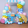 Pastel balloons and candy cutouts provide a sweet and playful atmosphere.