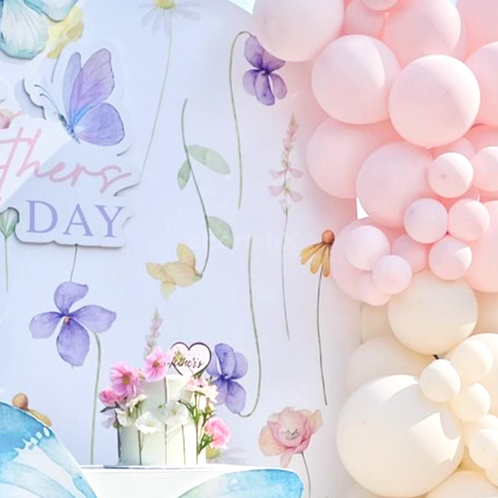 Intimate pastel balloon and butterfly decor close-up.
