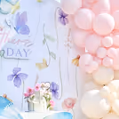 Intimate pastel balloon and butterfly decor close-up.