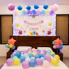 Fairy lights sparkle around a cozy "Welcome Baby" bunting.
