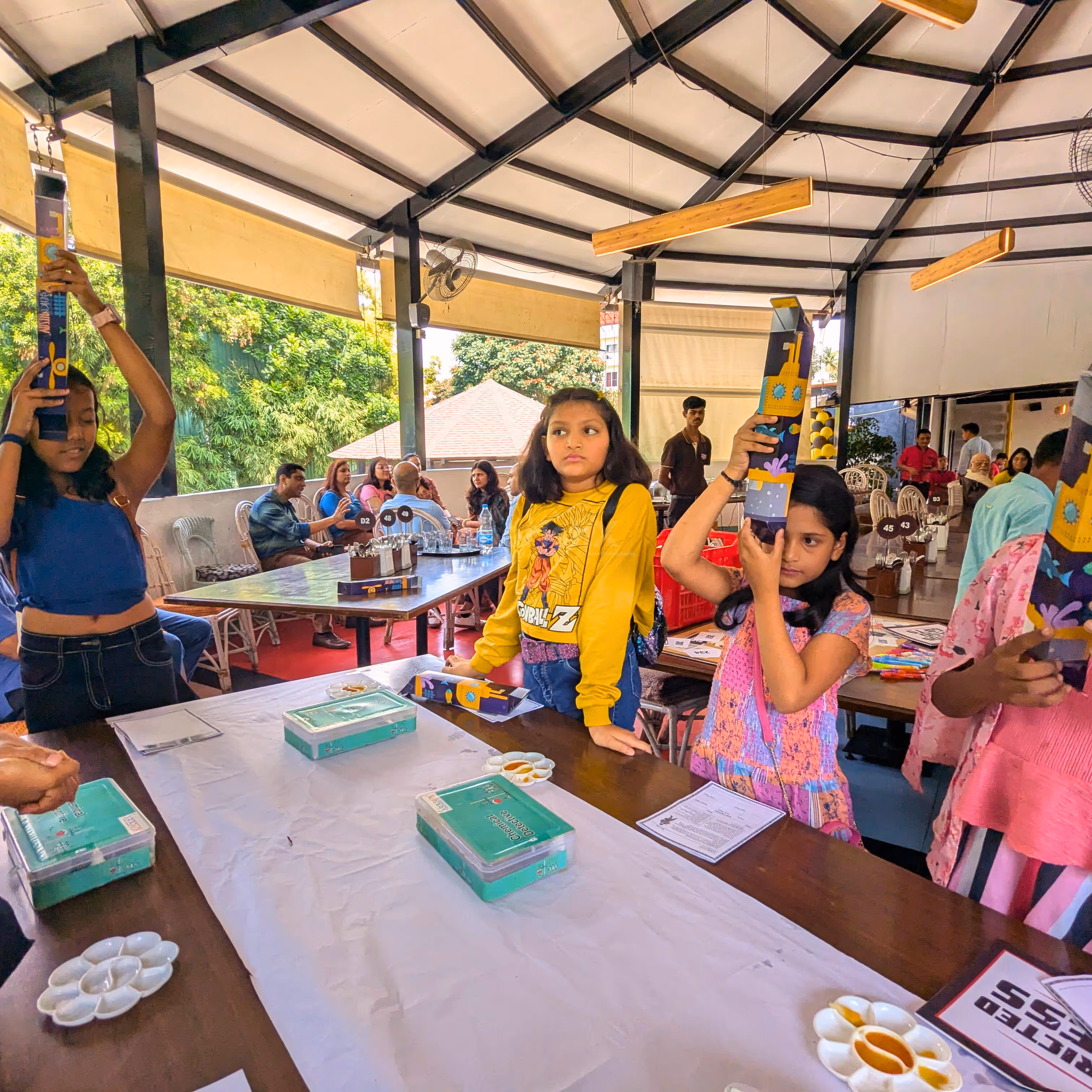 Little explorers testing their handmade periscopes